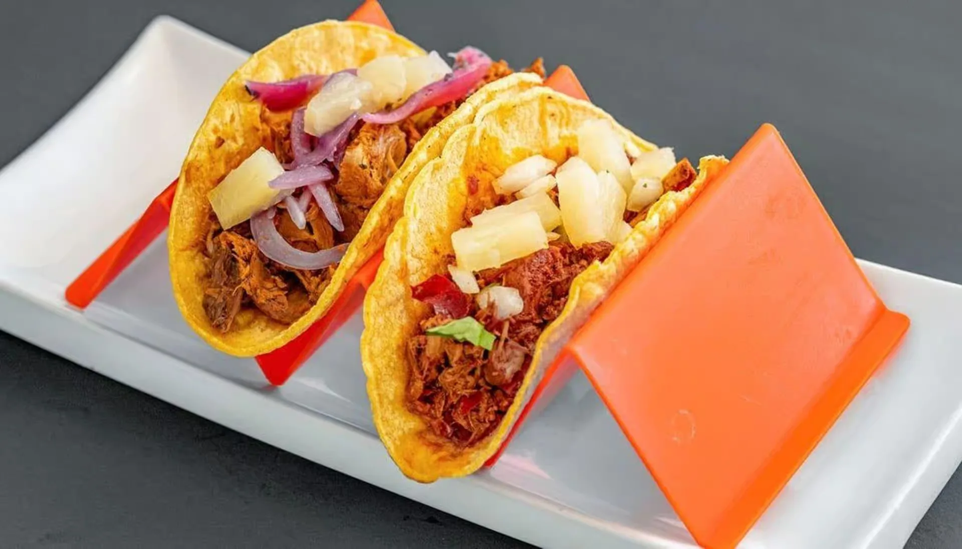 Al pastor pork tacos on fresh tortillas at La Taqueria Mexican Street Tacos in Winnipeg